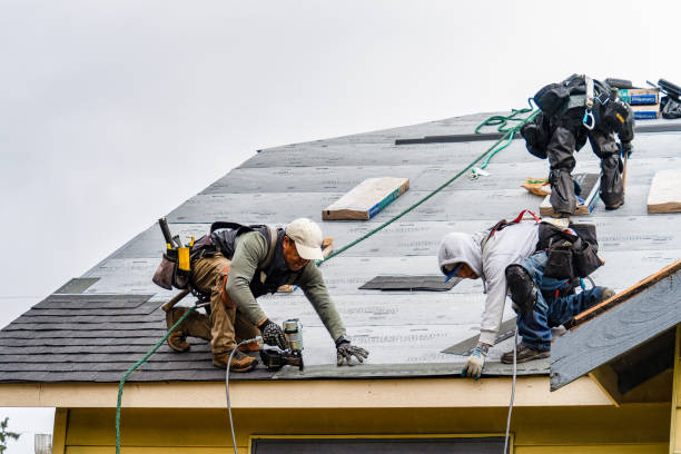 Professional Storm Damage Roof Repair technician working in Pembroke, MA